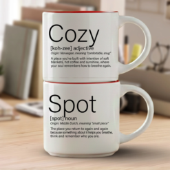 Cozy + Spot mug set in Elegant Light font, two 14-ounce white stackable mugs with Red interiors and Meaningful Word Story Style definitions on a writer’s desk