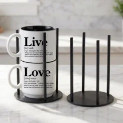 Our black metal Storyteller Display Stands hold a stack of 14-ounce Coffee & Words mugs and fit neatly on any counter or coffee bar.