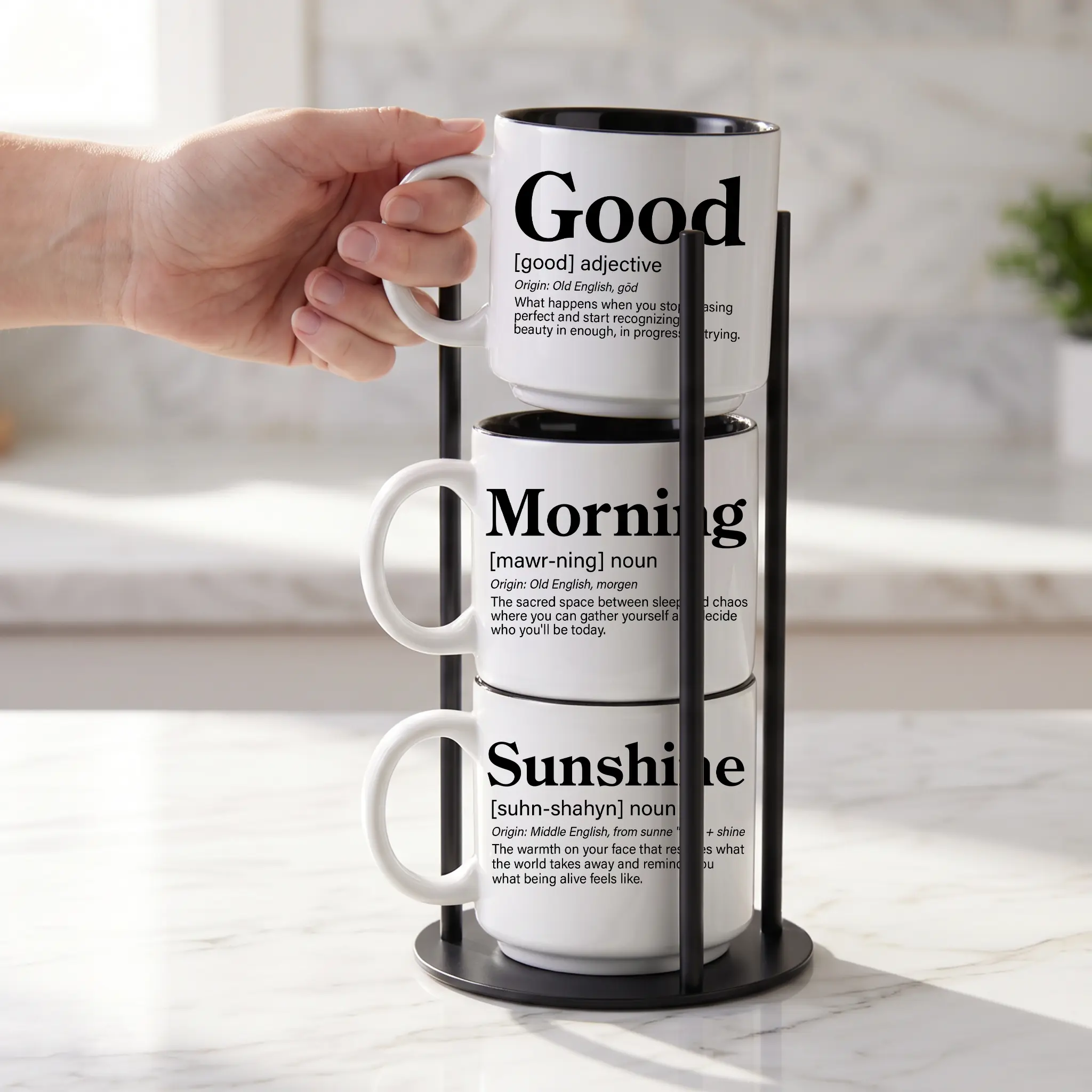 Our black metal Storyteller Display Stands hold a stack of 14-ounce Coffee & Words mugs and fit neatly on any counter or coffee bar.