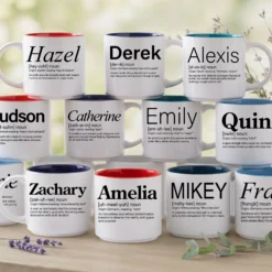 Personalized name meaning mugs stacked in rows, with first names like Hazel, Derek, Alexis and Emily in four interior colors.