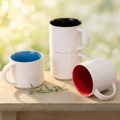 14-ounce stackable metro mugs with white exteriors and Ocean Blue, Black and Red interiors